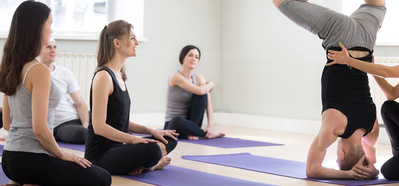 hands on yoga assist with yoga instructor. why niagara studio yoga by sarah is releasing consent cards